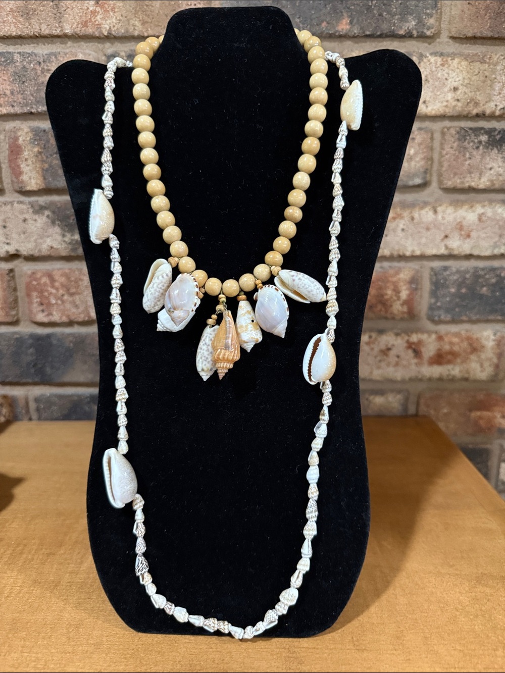 Shell necklaces -wooden beaded with shell pendants and long cowrie necklace